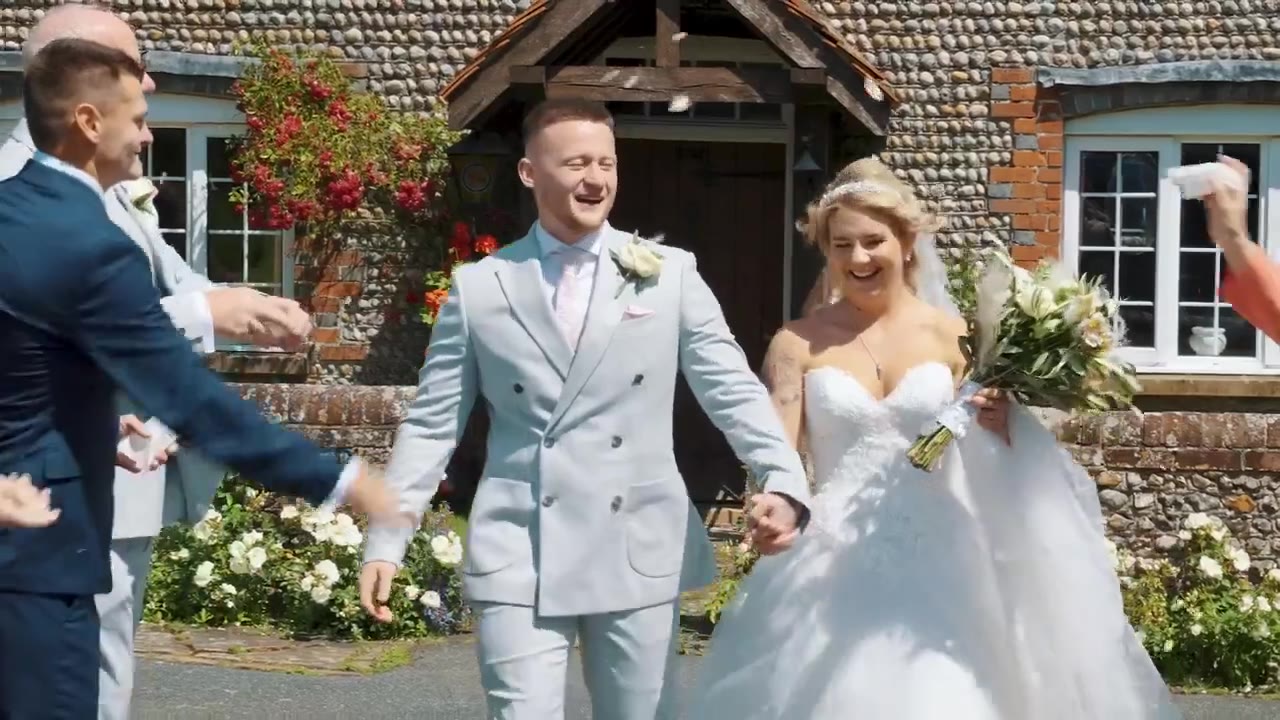Couple walking through confetti after the ceremony